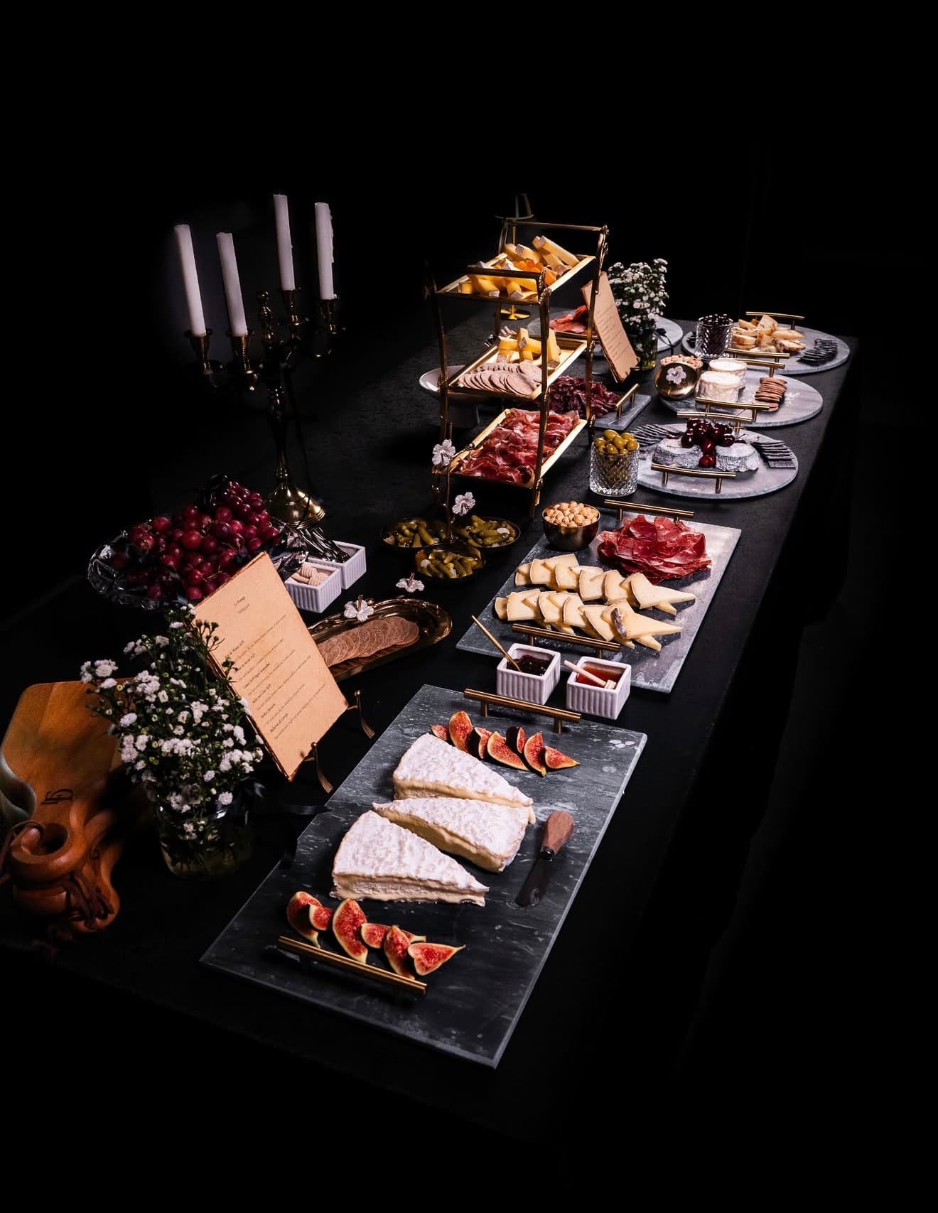 Elegant grazing table with artisan cheese and garnish